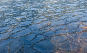 Sheet of ice covers the desert floor to be melted by the first rays of sun.