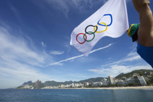 Olympic flag flies over Ipanema Beach in Rio de Janeiro, Brazil
