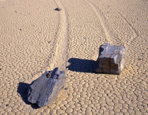 Two rocks move by themselves, leaving a long trail behind them