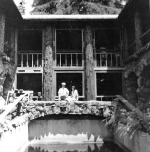 Jack and Charmian in the center of Wolf House overlooking the swimming pool which is not yet filled