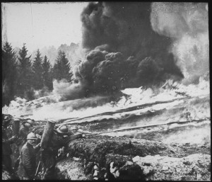 French soldiers making a gas and flame attack on German Trenches in Flanders during World War One.