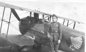 James Norman Hall standing next to his plane.