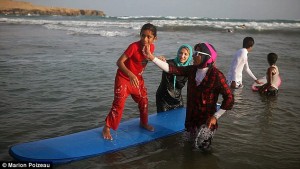 Briton, teaching women surfing on the coast of Iran