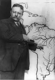 Theodore Roosevelt explains to the Press Corp, his proposed route down the "River of Doubt" in Brazil. It almost cost him his life.
